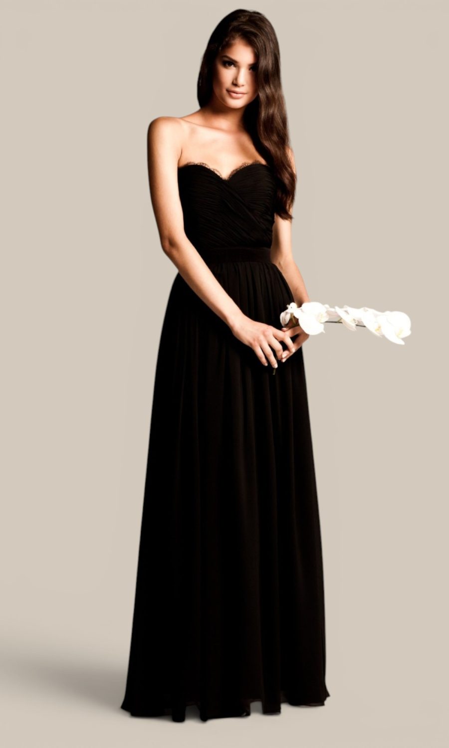 Black chiffon long bridesmaid dress by Natasha Millani featuring eyelash Chantilly lace trim, beautifully unifying the bridal party aesthetic.