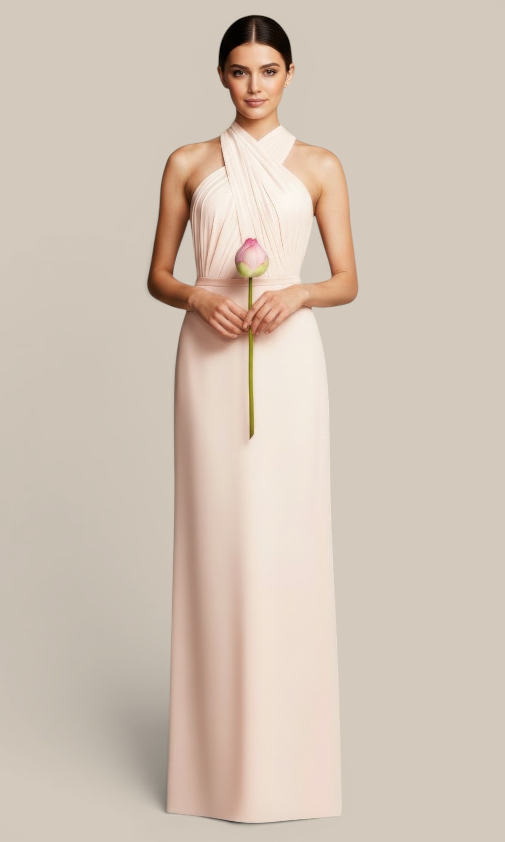 Natasha Millani blush pink draped cross halter bridesmaid gown, styled with a matching pink lotus flower for cohesive mismatched wedding palette.