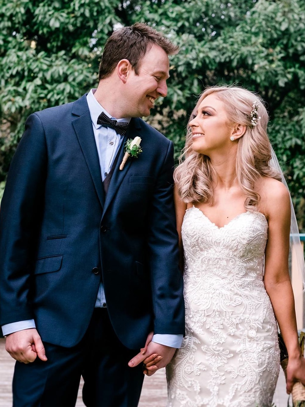 Hayley and Tim smiling together on their wedding day.