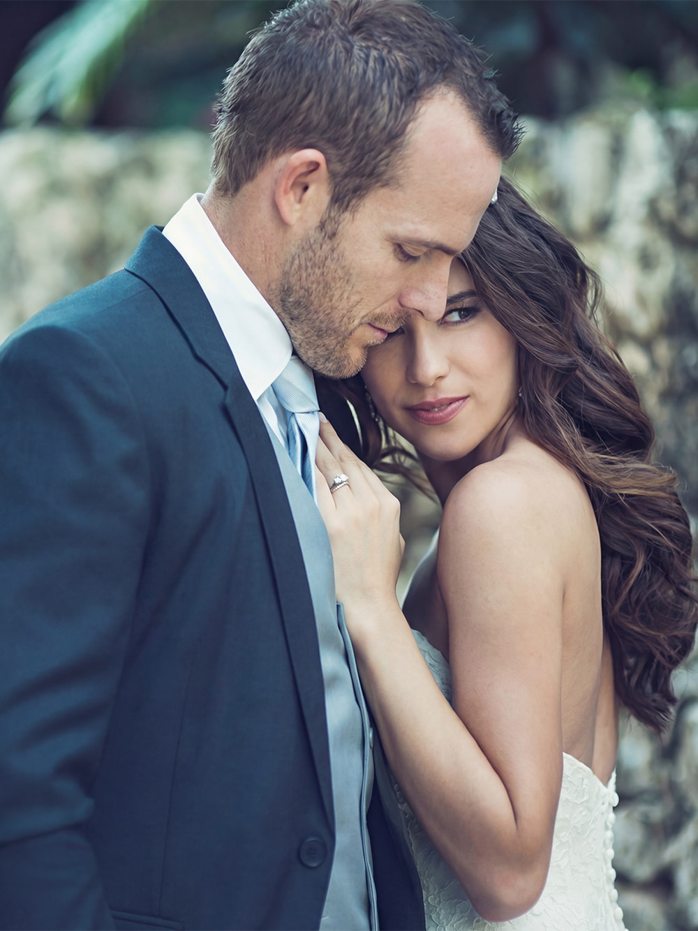 Natalie and Heith sharing a romantic moment at their elegant wedding.