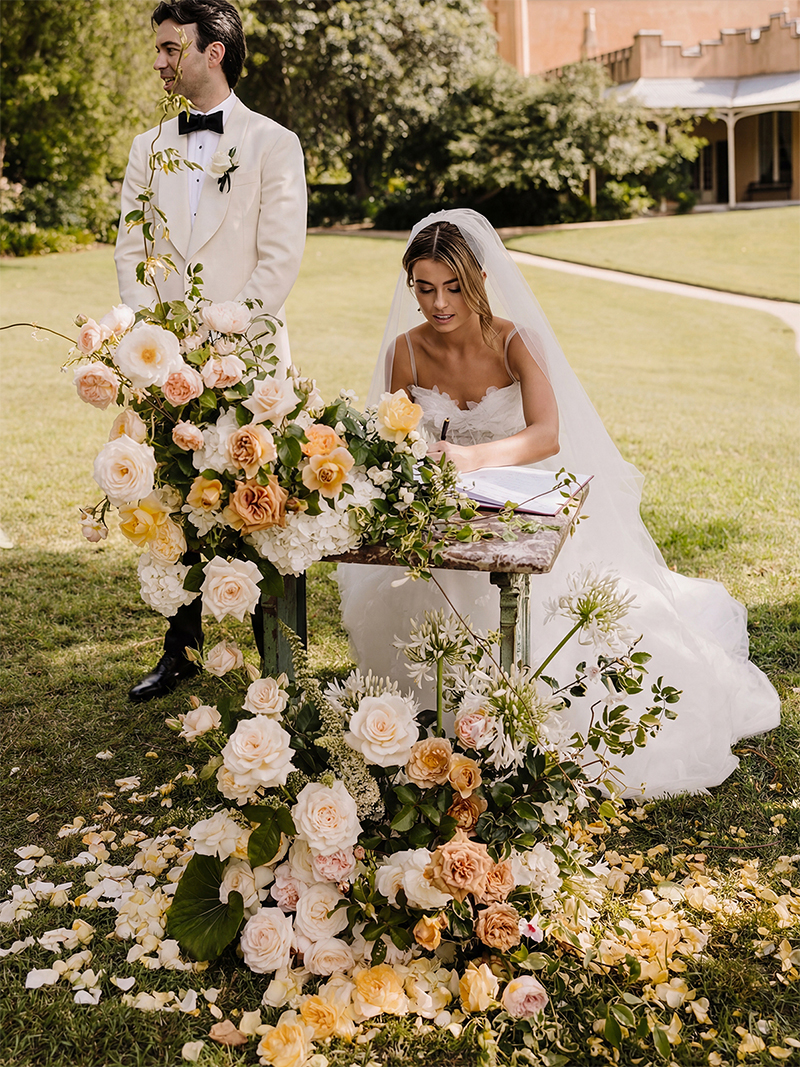 Elegant wedding garden reception flower arrangement for neutral wedding theme.