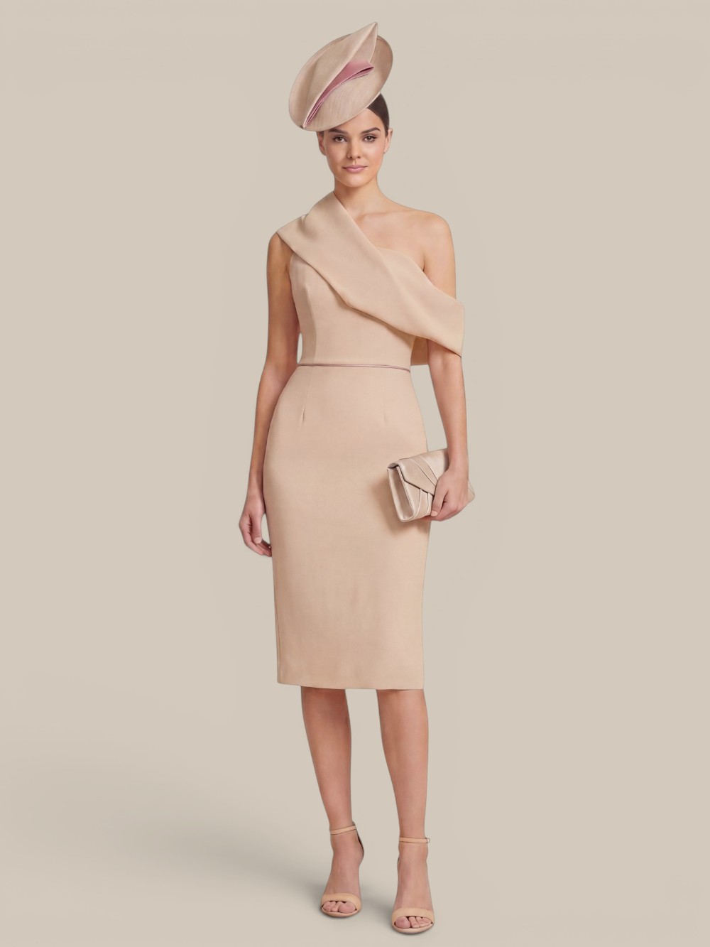 chic-beige-cocktail-dress-for-spring-racing-carnival Beige bridesmaid dress altered into a chic knee-length cocktail dress, styled with a fascinator for the races. Perfect example of re-wearability of our versatile bridesmaid dresses.